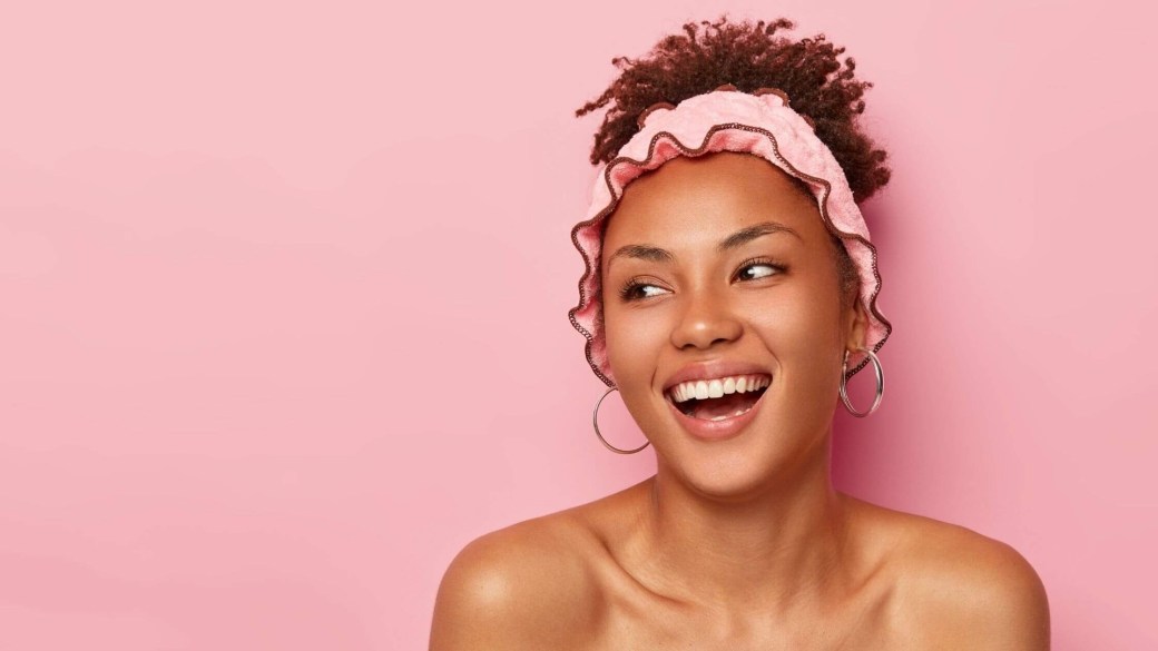 Girl with glowing skin and curls