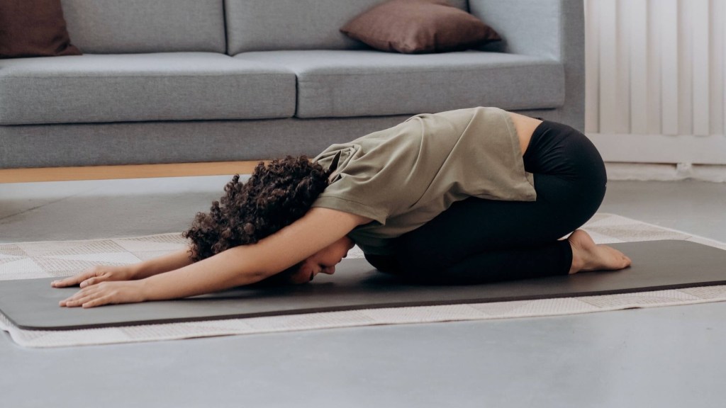 A Women doing stretches for Back pain
